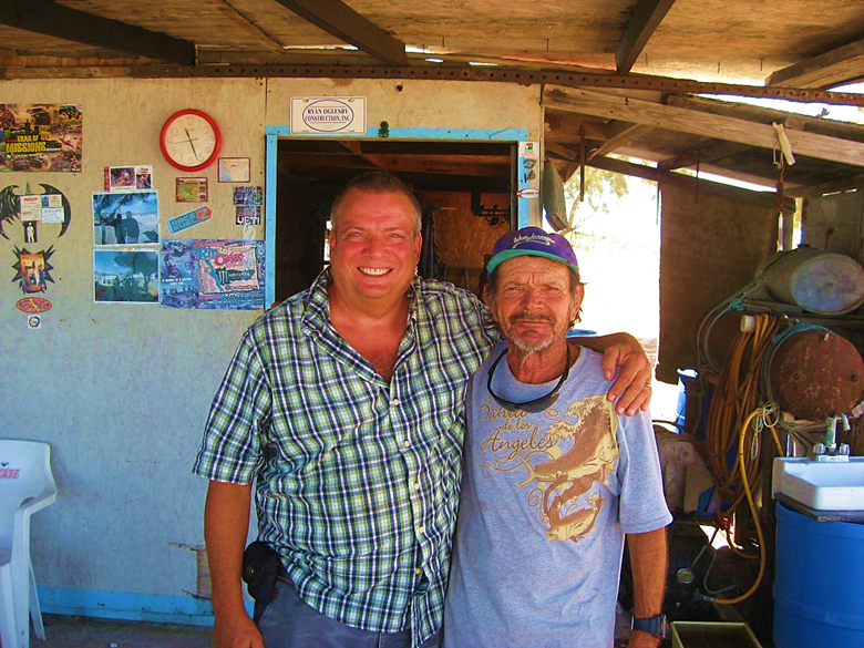 A person standing in front of a barrel Description automatically generated