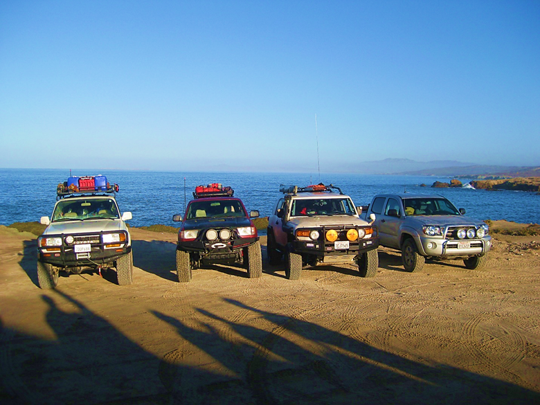 A car parked on a beach Description automatically generated