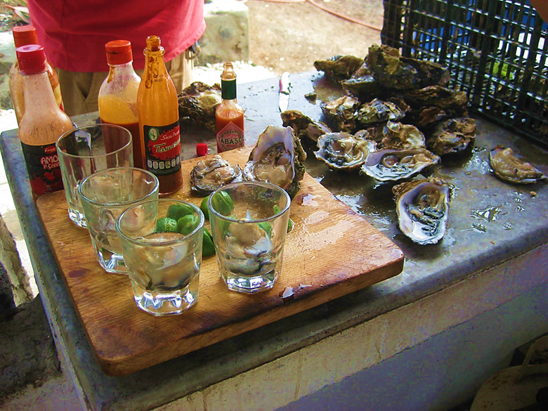 A picture containing outdoor, table, food, sitting Description automatically generated